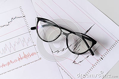 Ð¡loseup of part of graphs and charts printed on the paper. Selective focus. Stock Photo